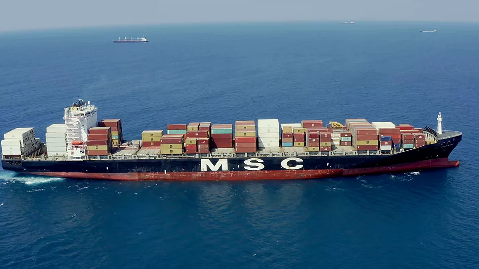 A large container ship sailing across open water